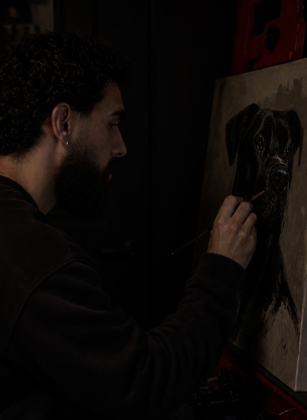 Dayan Glez painting a pet portrait at XOX Studio